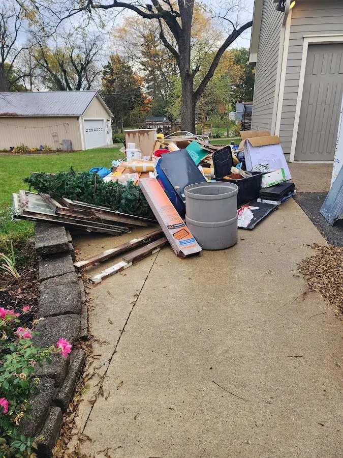 Dumpster being loaded with debris for Demolition Dumpster Rental in Windom